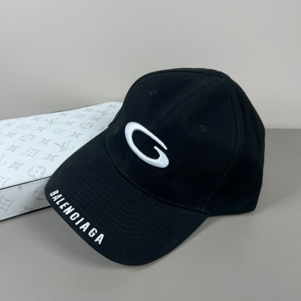 Black cotton cap with white oval emblem embroidery